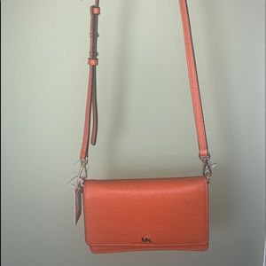 Orange Micheal Kors crossbody bag
